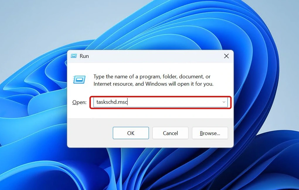 Windows Run dialog with taskschd.msc typed into the Open field